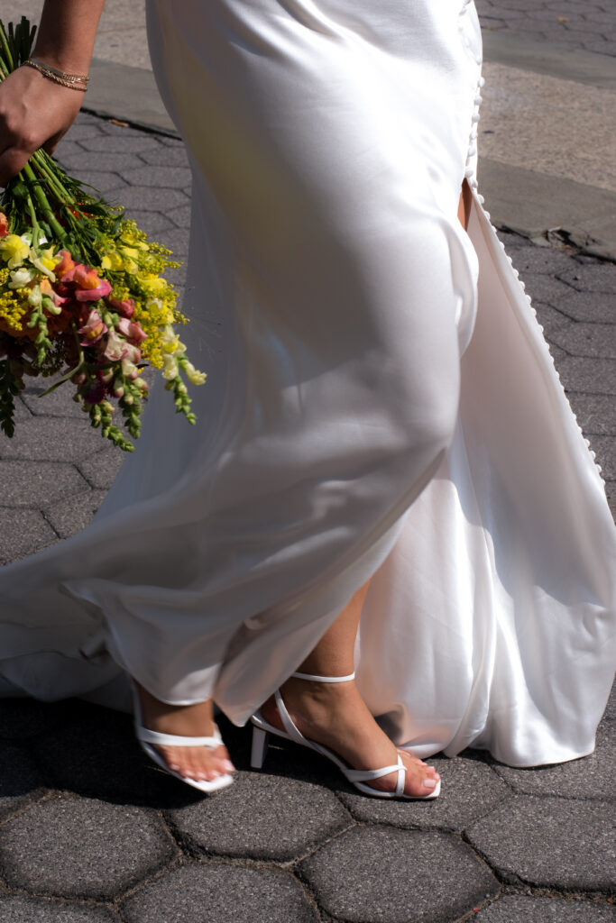 photo of bride dress gown and bouquet details post new york city hall wedding, stef reyes photo