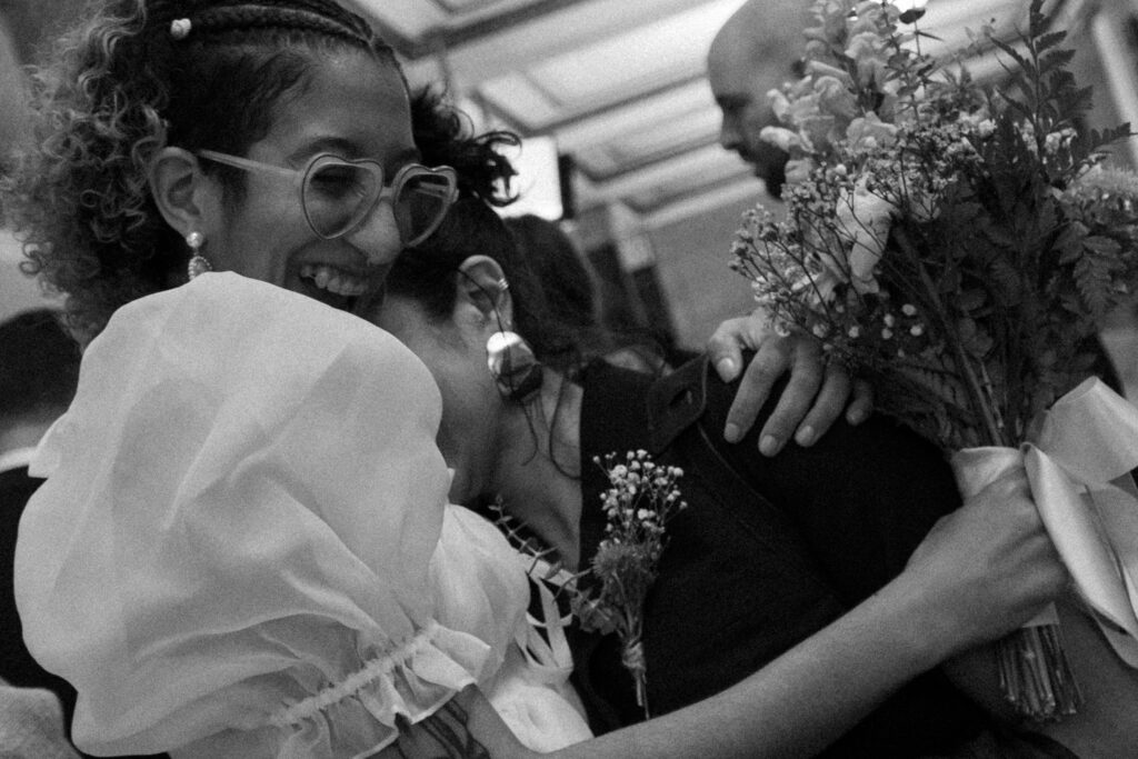 Photo of bride and sister embracing each other before bride enters her nyc courthouse ceremony, stef reyes photo