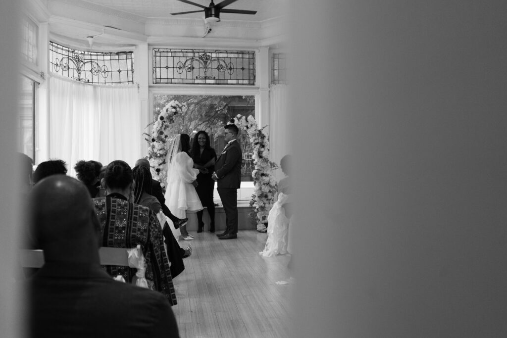 photo of a wedding ceremony inside of intimate gathering event space, atrium82, in brooklyn ny. taken by stef reyes photo. 