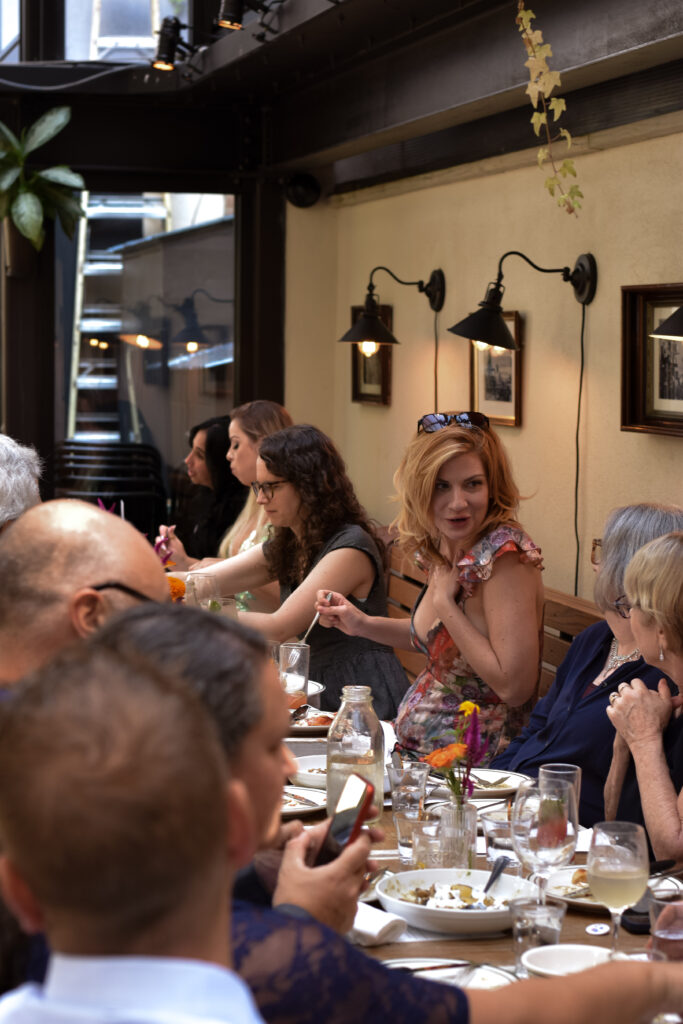 candid photos of guest at restaurant wedding reception in brooklyn ny, taken by stef reyes photo. 