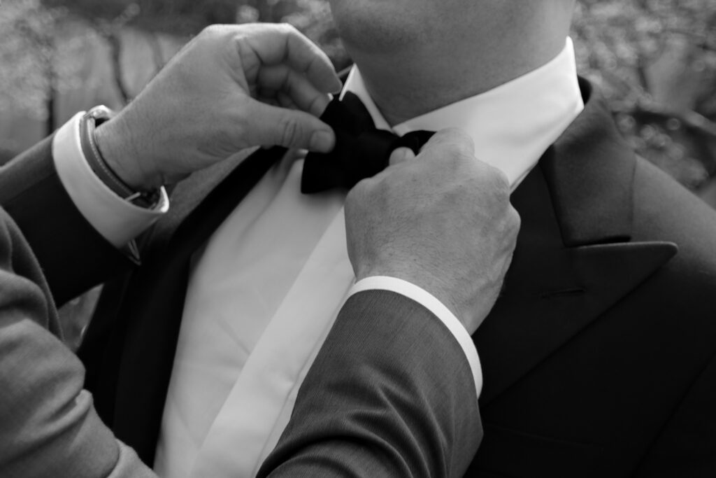 photo of groom and dad fixing tie outside of manhattan city hall, stef reyes photo. 