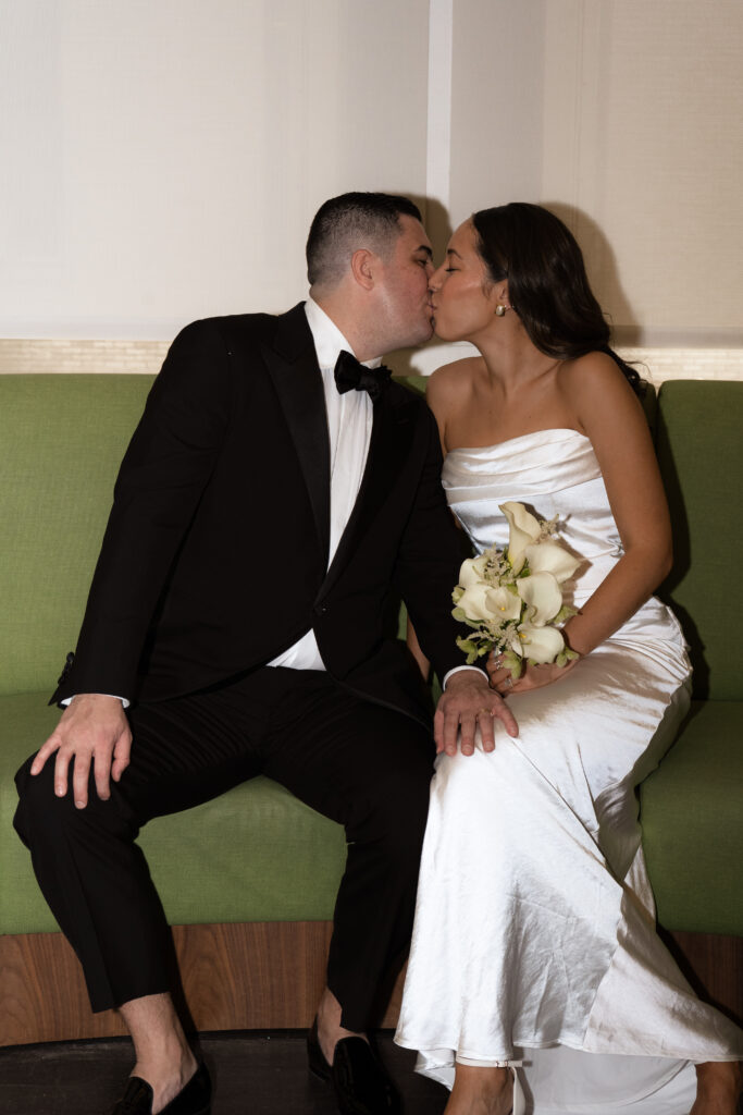 photo of couple on the green couch inside of manhattan city hall elopement, stef reyes photo