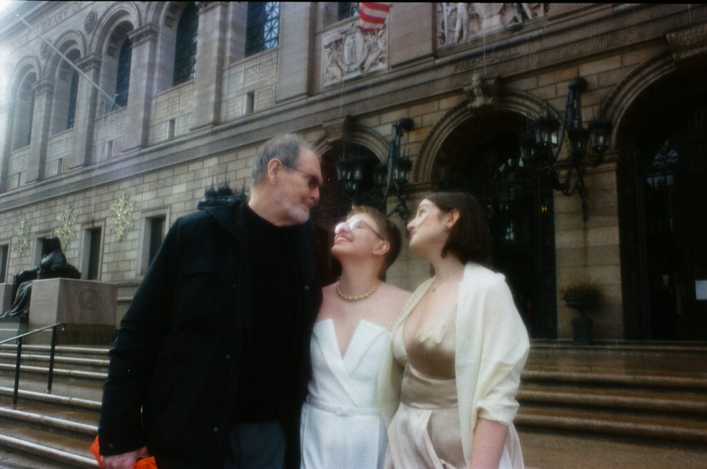 brides take a portrait with father before they go in for their boston public library elopement.