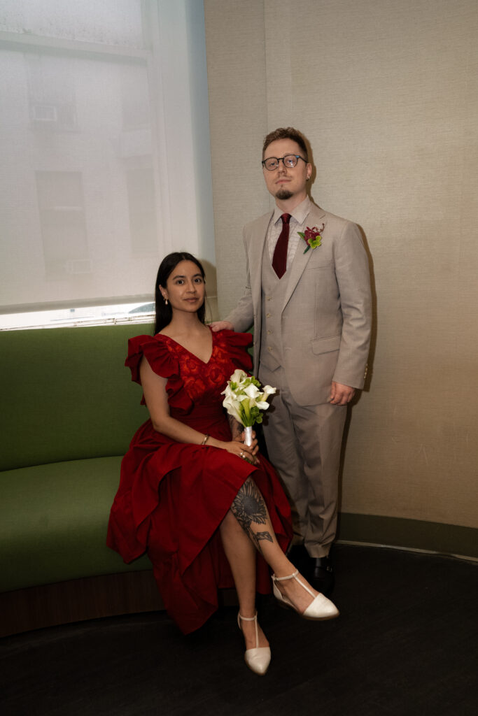 photo of couple near the green couch inside of manhattan city hall elopement, stef reyes photo