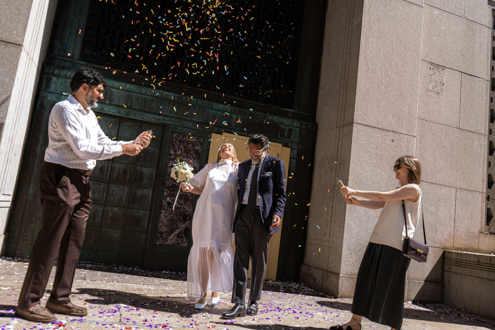 Couple exiting and celebrating their court house wedding ceremony, stef reyes photo