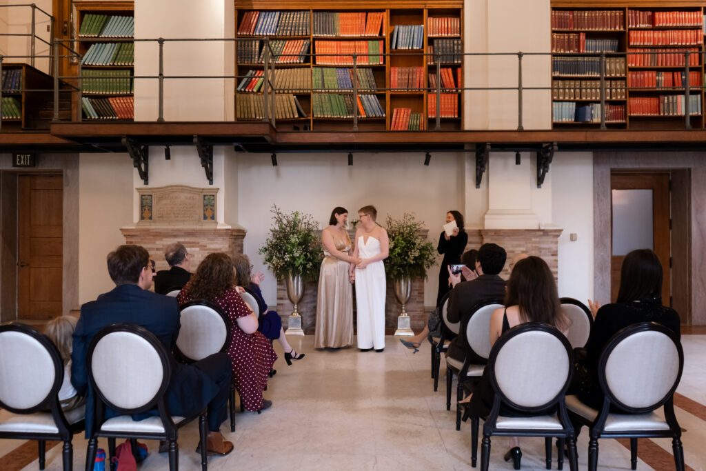 photo of a queer weddig inside of boston public library. taken by stef reyes photo. 