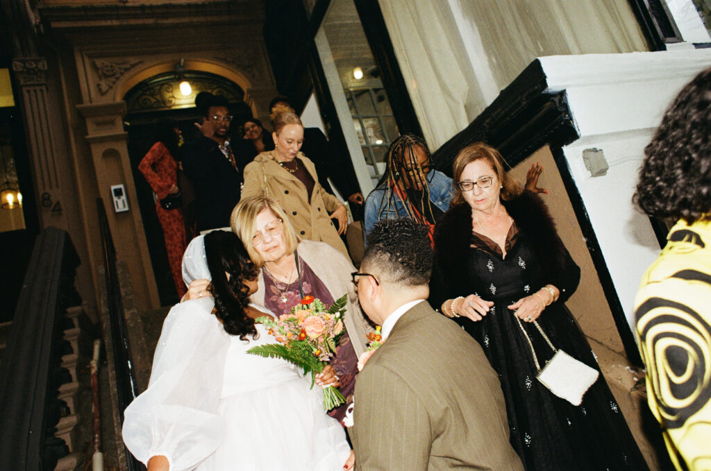 family candids at intimate wedding reception in brooklyn ny, documentary wedding photographer, stef reyes photo.
